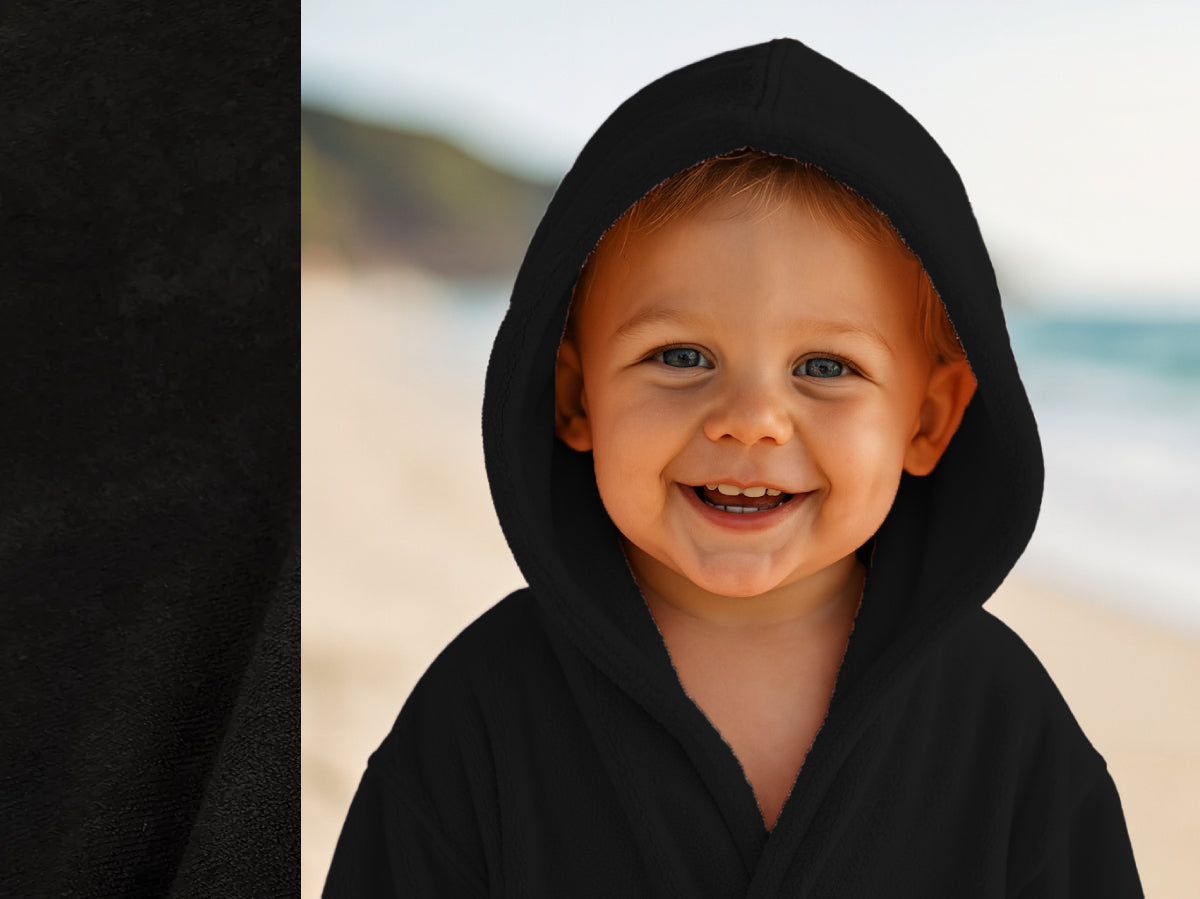 Black towel hoodie on toddler at beach – Bean Design