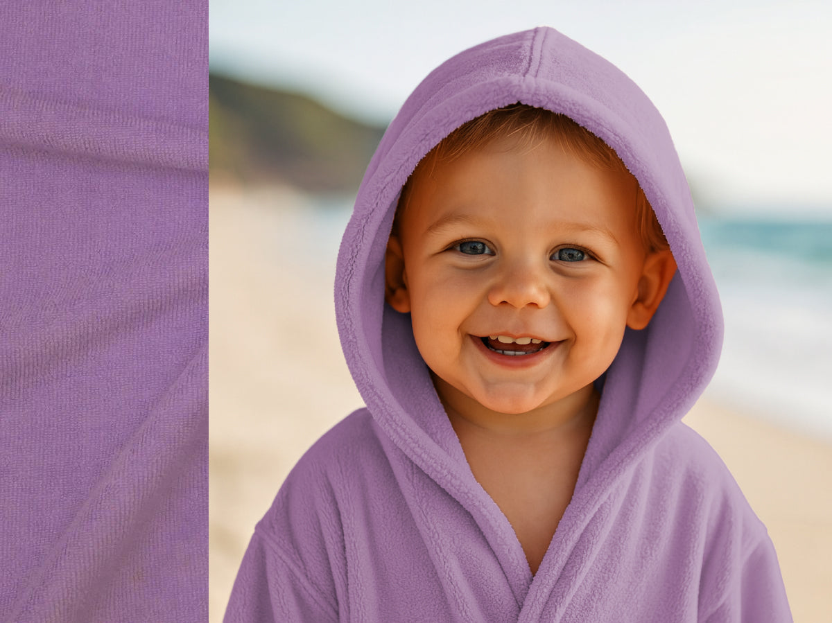 Lilac towel hoodie on toddler at beach – Bean Design