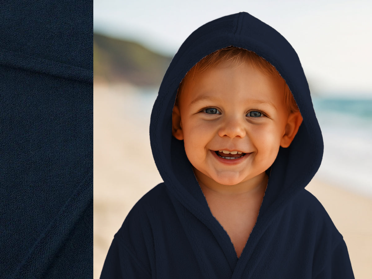 Navy towel hoodie on toddler at beach – Bean Design