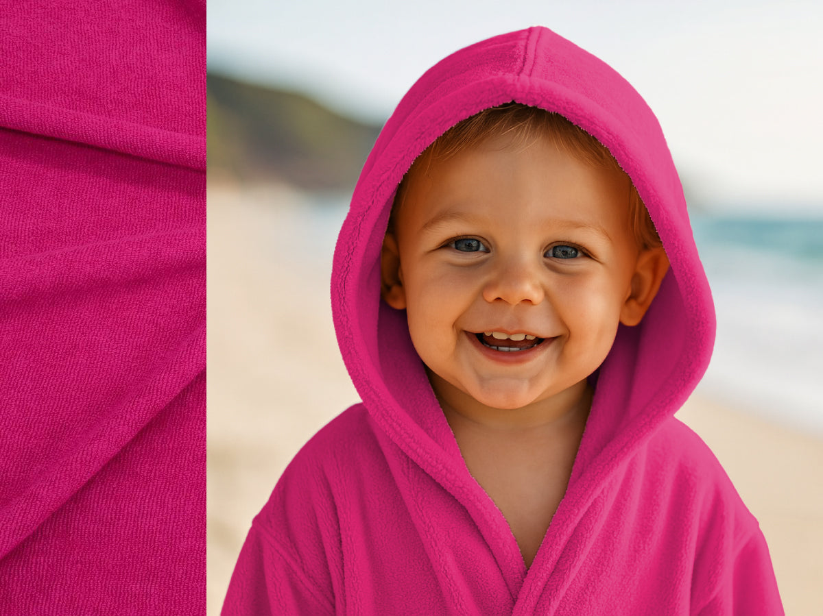 Pink towel hoodie on toddler at beach – Bean Design