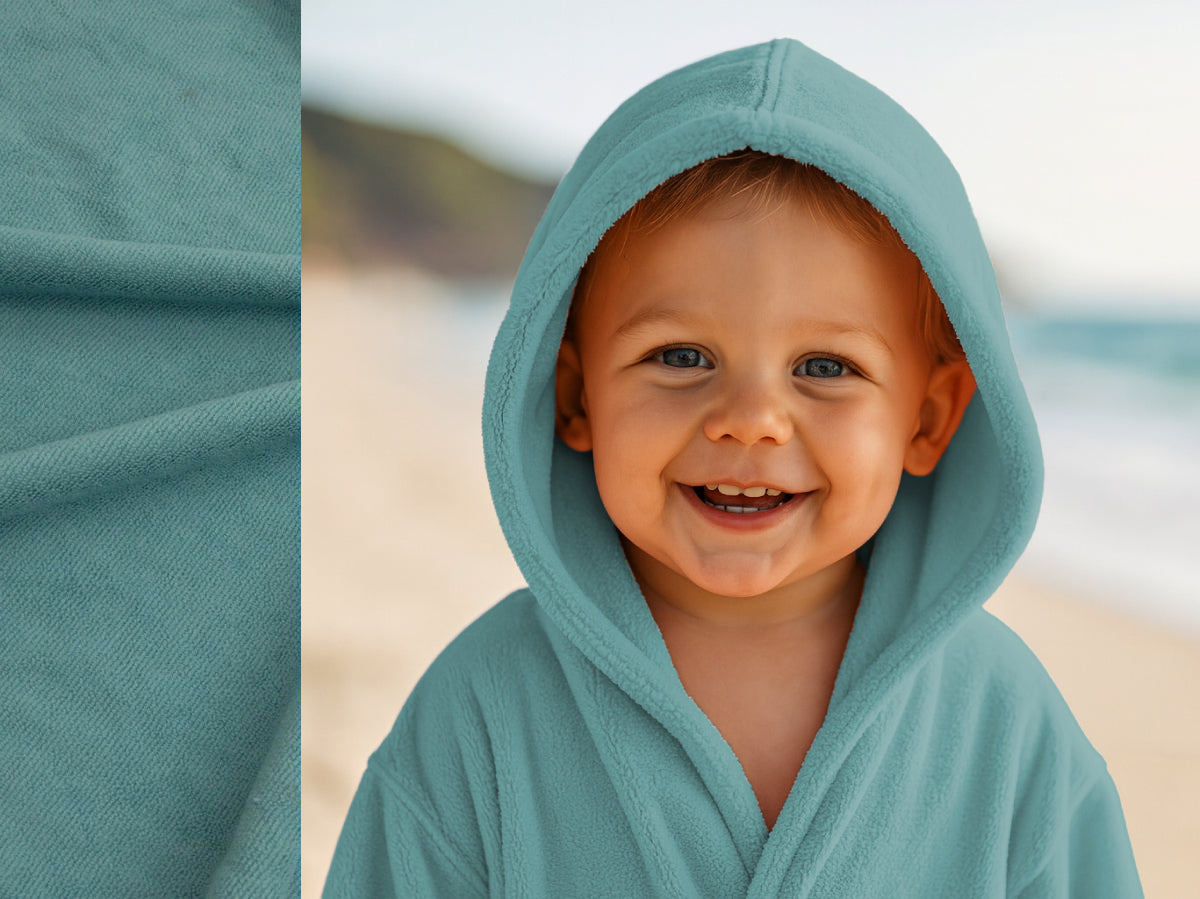 Teal towel hoodie on toddler at beach – Bean Design
