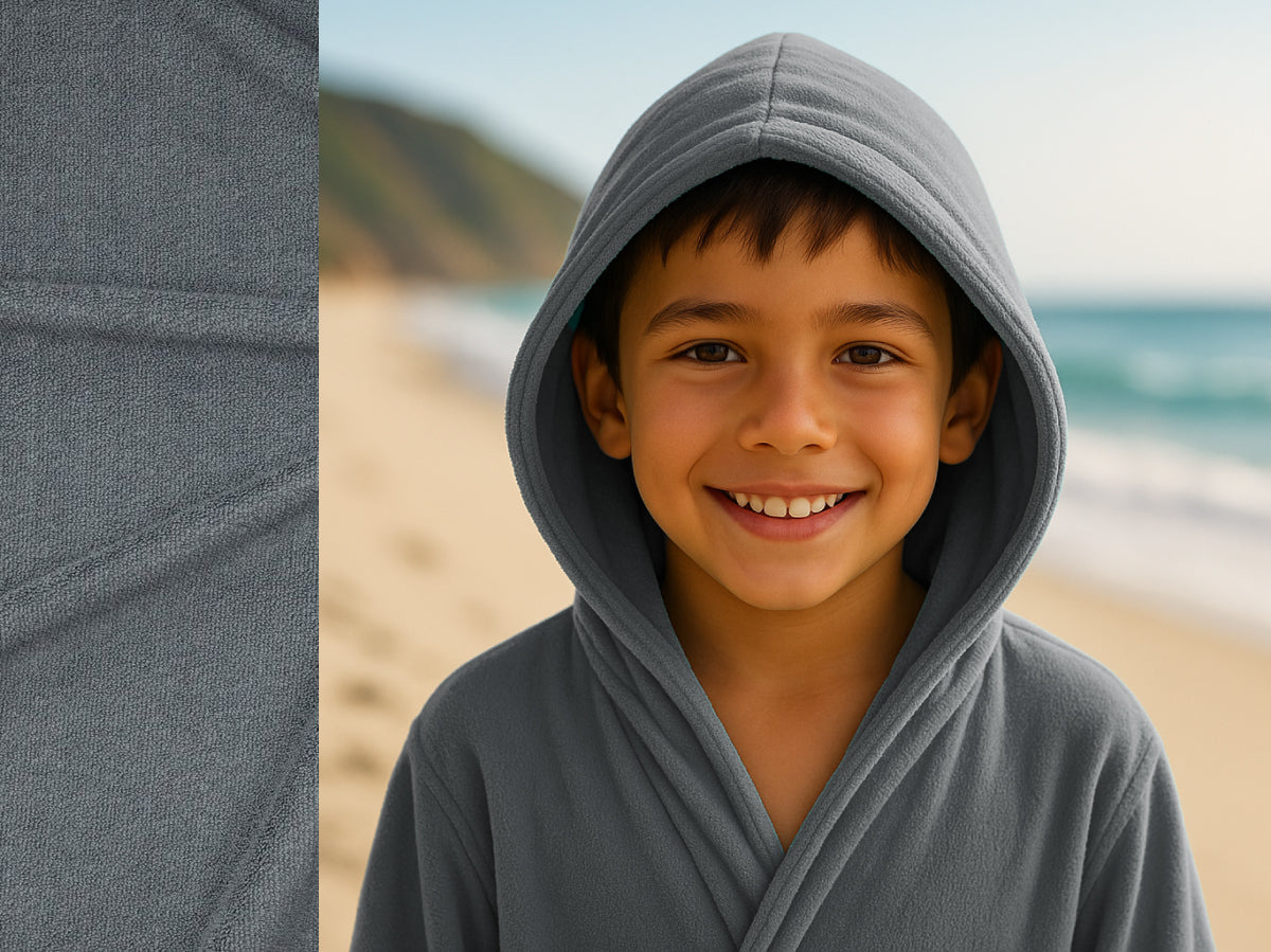 Grey towel hoodie on kid at beach – Bean Design