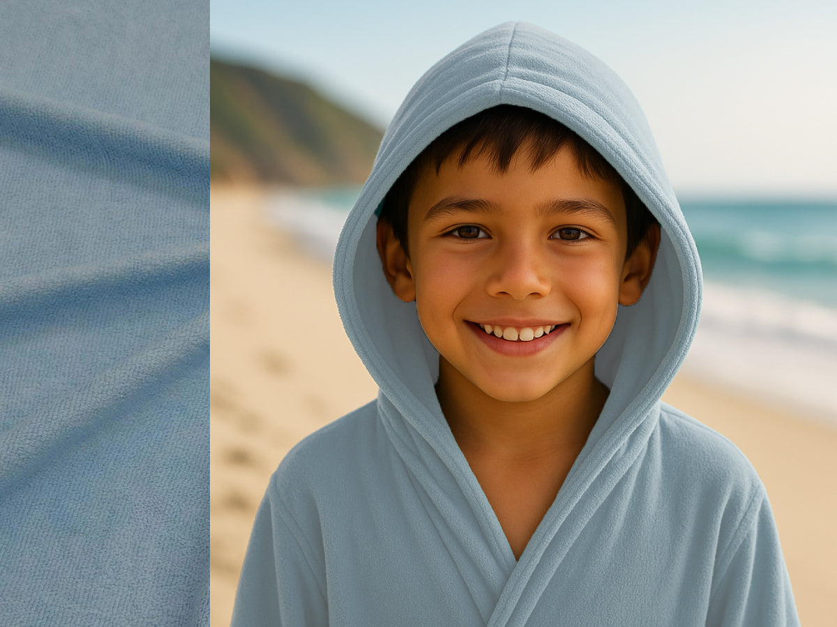 Light Blue towel hoodie on kid at beach – Bean Design