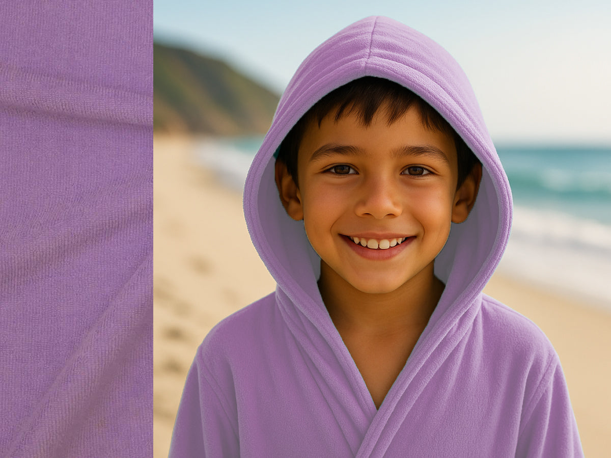 Lilac towel hoodie on kid at beach – Bean Design