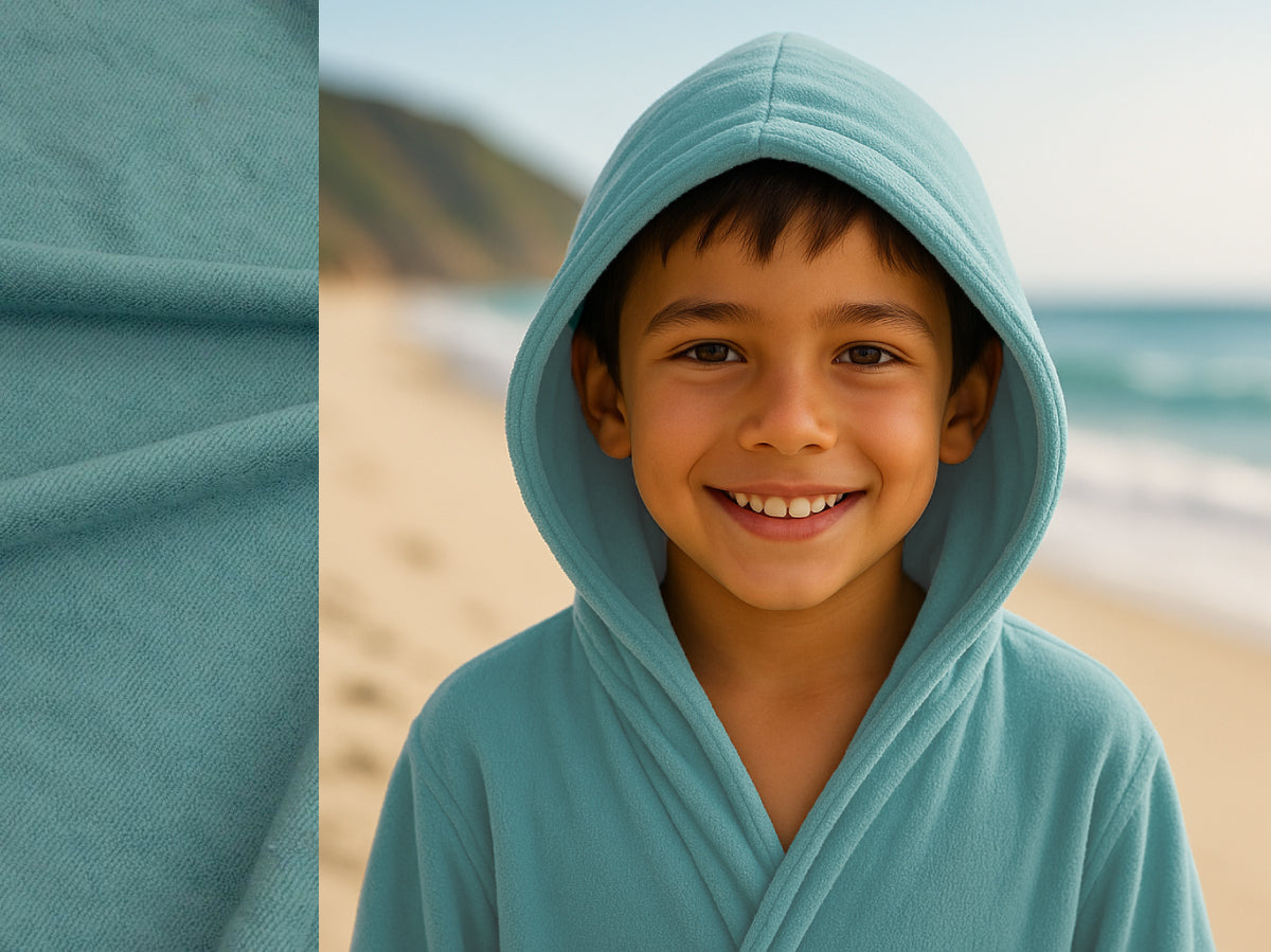 Teal towel hoodie on kid at beach – Bean Design