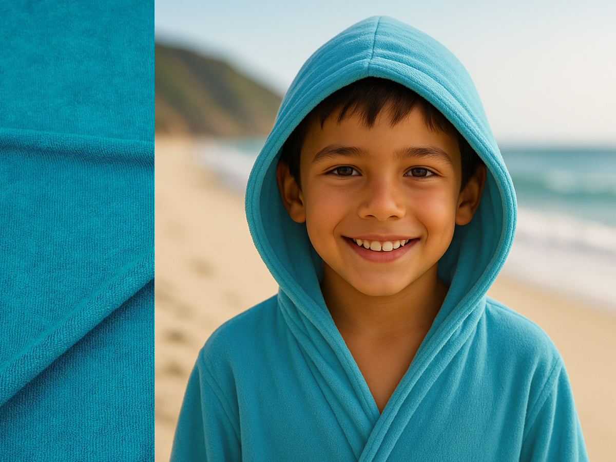 Turquoise towel hoodie on kid at beach – Bean Design
